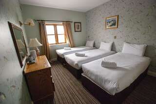 Отели типа «постель и завтрак» The Arch Guesthouse Килкенни Трехместный номер с основными удобствами-1